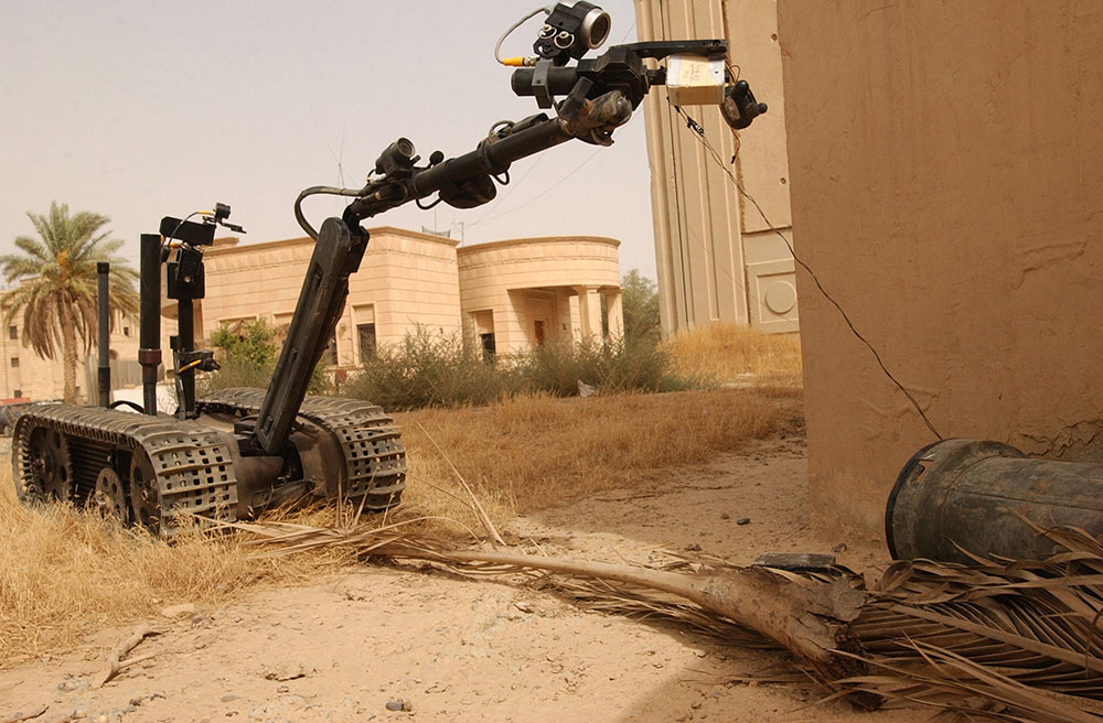 The TALON, shown in use in Tikrit, Iraq, in 2005, was among the first systems that allowed Soldiers to disarm IEDs from a distance, using a remote controller in the EOD vehicle. In an effort to standardize its robotic platforms and reduce its operational footprint, the Army plans to replace the TALON with MTRS, a 164-pound tracked vehicle that can identify and clear land mines, IEDs and CBRN hazards. (Photo courtesy of 22nd Mobile Public Affairs Detachment)