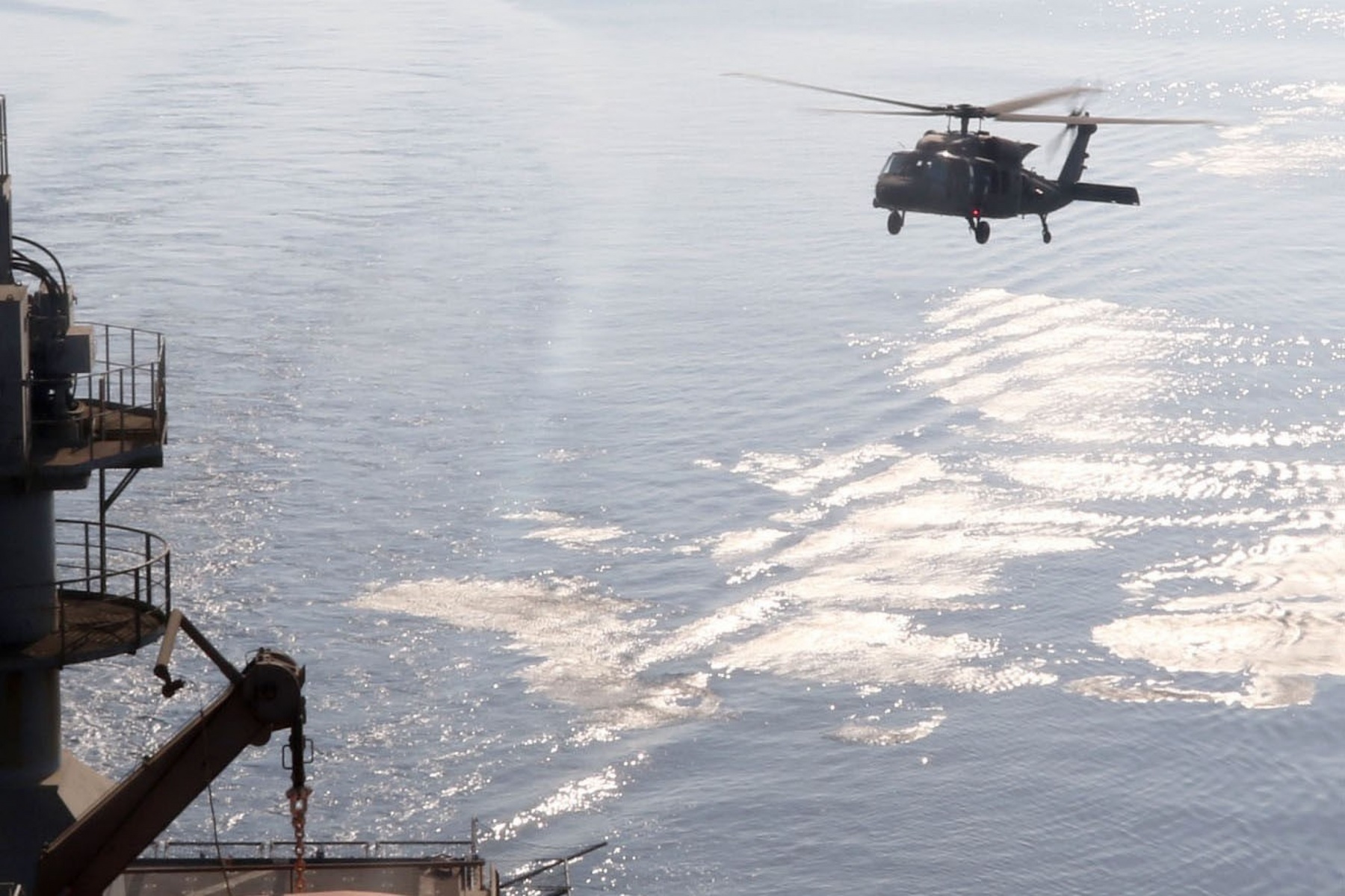 Soldiers assigned to Bravo and Headquarters Company, 1st Brigade, 147th Air Assault Helicopter Battalion, and 2nd Brigade, 149th Air General Support Aviation Battalion, conduct a deck landing qualification with a UH-60 Black Hawk on a U.S. Navy ship on Aug. 9, 2017, in the Arabian Gulf. The Black Hawk is one of the military systems developed in the 1970s known as the Big Six. It remains a core element of the Army’s military power today. (U.S. Army photo by Staff Sgt. Jeremy Miller, 35th Infantry Division)