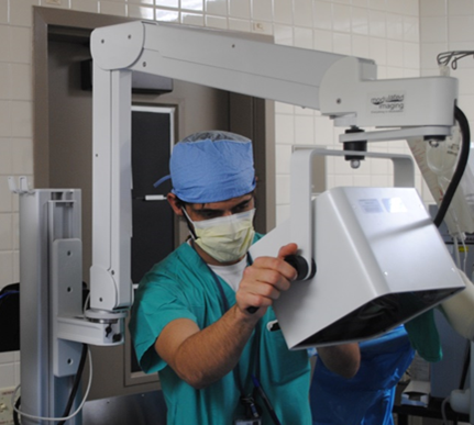 A clinician operates an SFDI unit, which is being developed and commercialized by California-based Modulated Imaging Inc. and uses the principles of diffuse optical spectroscopy to determine whether burned tissue is suitable for reconstructive surgery. (Photo by University of California, Irvine)