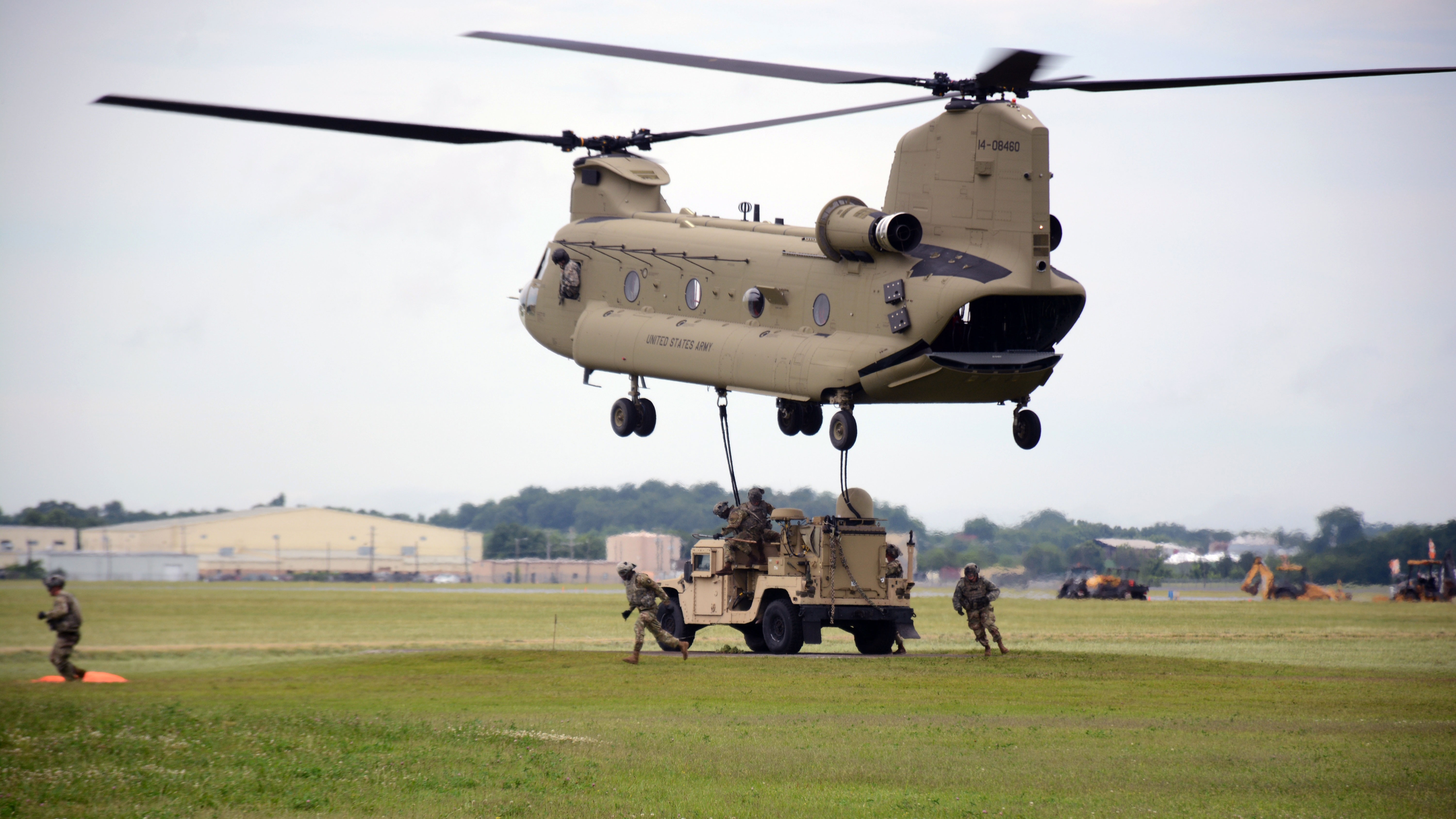 Soldiers from the 2nd Brigade Combat Team (BCT), 101st Airborne Division (Air Assault) move away from a CH-47 Chinook after successfully hanging the Tactical Communications Node-Light during a sling load exercise at Fort Campbell, Kentucky, in June 2017. The new systems can be sling-loaded from a helicopter or rolled onto a C130 aircraft, improving agility and operational flexibility and aiding Army efforts to deploy right-sized units across contested domains at every stage of operations. (U.S. Army photo by 1st Lt. Daniel Johnson, 2nd BCT, 101st Airborne Division Public Affairs)
