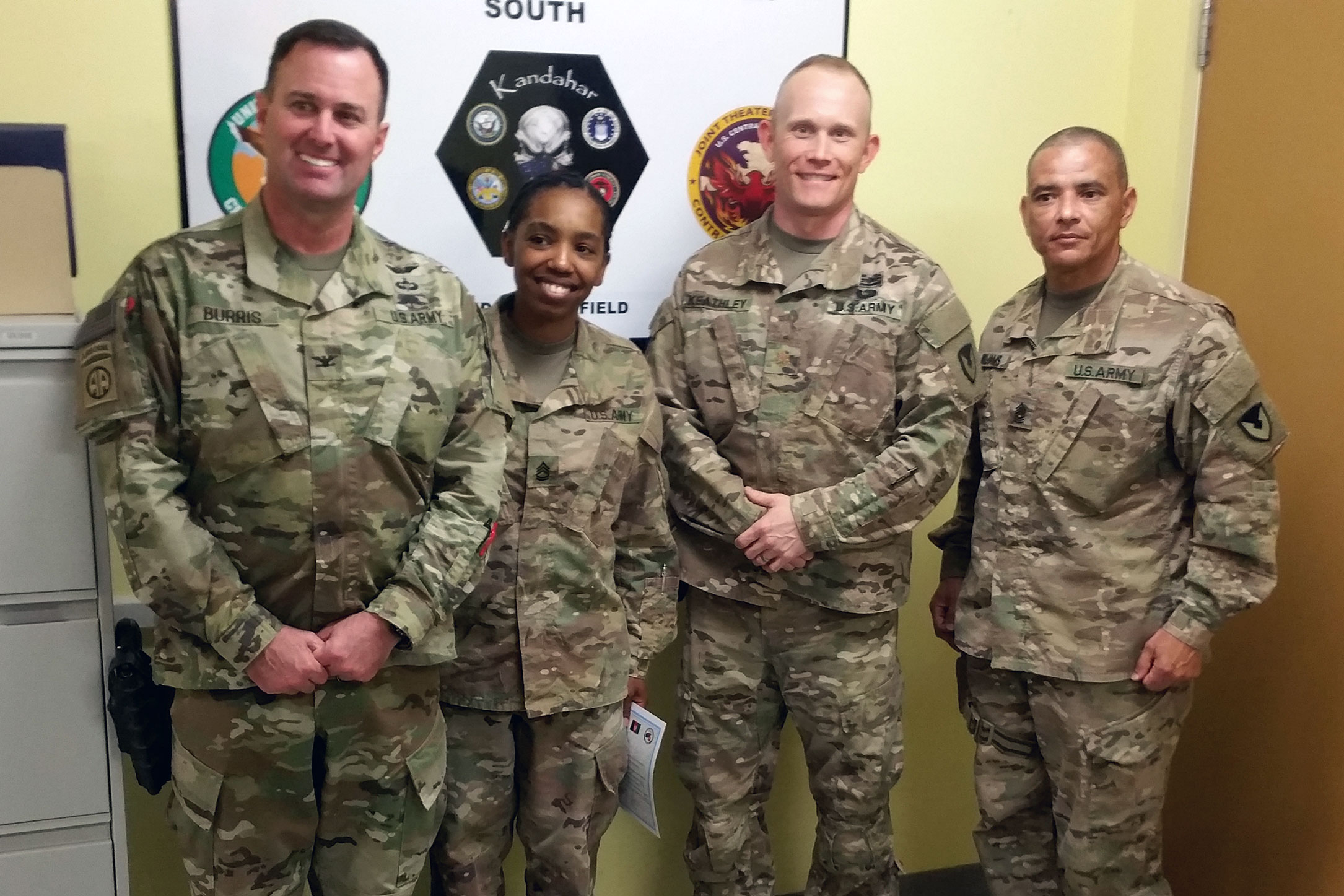 Left to right, Col. Joshua Burris, Expeditionary Contracting Command – Afghanistan commander; Sgt. 1st Class Katrina Tolbert, noncommissioned officer in charge for RCO-S; the author; and Command Sgt. Maj. Charles Williams. (U.S. Army photo by Staff Sgt. Jeremy Kinney, 410th Contracting Support Battalion)