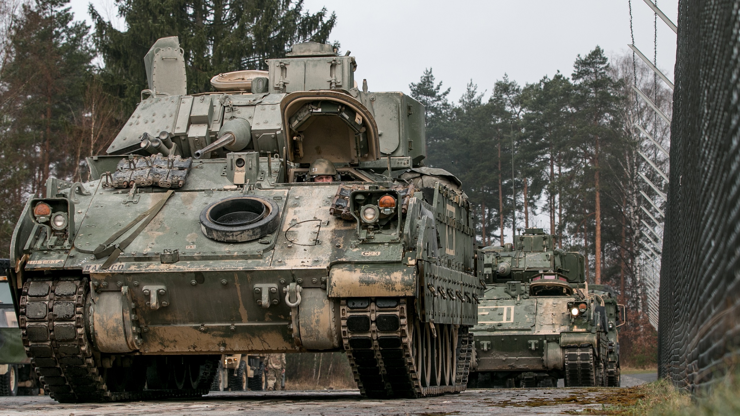 M2 Bradley fighting vehicles are lined up in Grafenwoehr, Germany to be fitted with Multiple Integrated Laser Engagement System (MILES) gear on April 11, 2018, in preparation for a field exercise during Combined Resolve X. Exercise Combined Resolve X is an U.S. Army Europe exercise series held twice a year in the major training areas of southeastern Germany, with this iteration scheduled to take place in April 2018. The Joint Warfighting Assessment leveraged Combined Resolve X, along with the Air Force’s Blue Flag, that were also occurring in Europe. (U.S. Army photo by Spc. Dustin D. Biven / 22nd Mobile Public Affairs Detachment) 