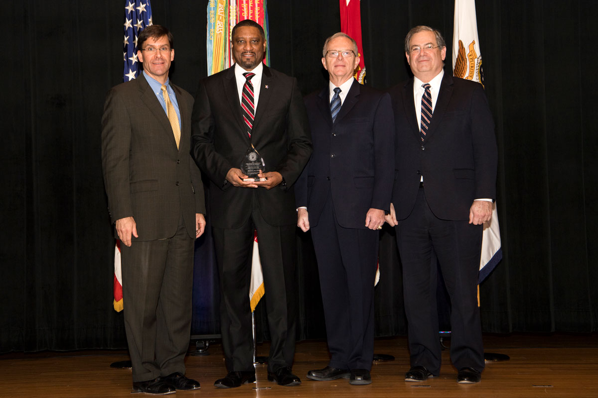 Billy McCain receives the 2017 Army Acquisition Executive’s Excellence in Leadership Logistician of the Year Award in January at the Pentagon. From left are Dr. Mark T. Esper, secretary of the Army; McCain; Dr. Bruce D. Jette, assistant secretary of the Army for acquisition, logistics and technology (ASA(ALT)) and the Army acquisition exeutive; and Jeffrey S. White, principal deputy to the ASA(ALT). (U.S. Army photo)