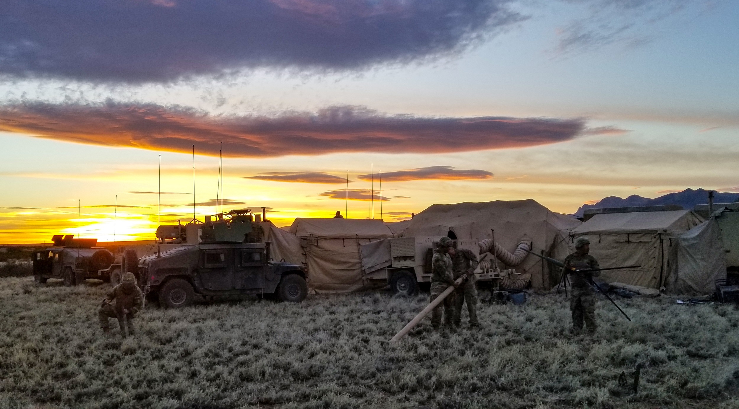 Soldiers assigned to Headquarters Company, 1st Battalion, 155th Infantry Regiment, work to establish communications during a field training exercise near Camp McGregor, N.M., April 6, 2018. (U.S. Army National Guard photo by Sgt. Timothy Russell) 