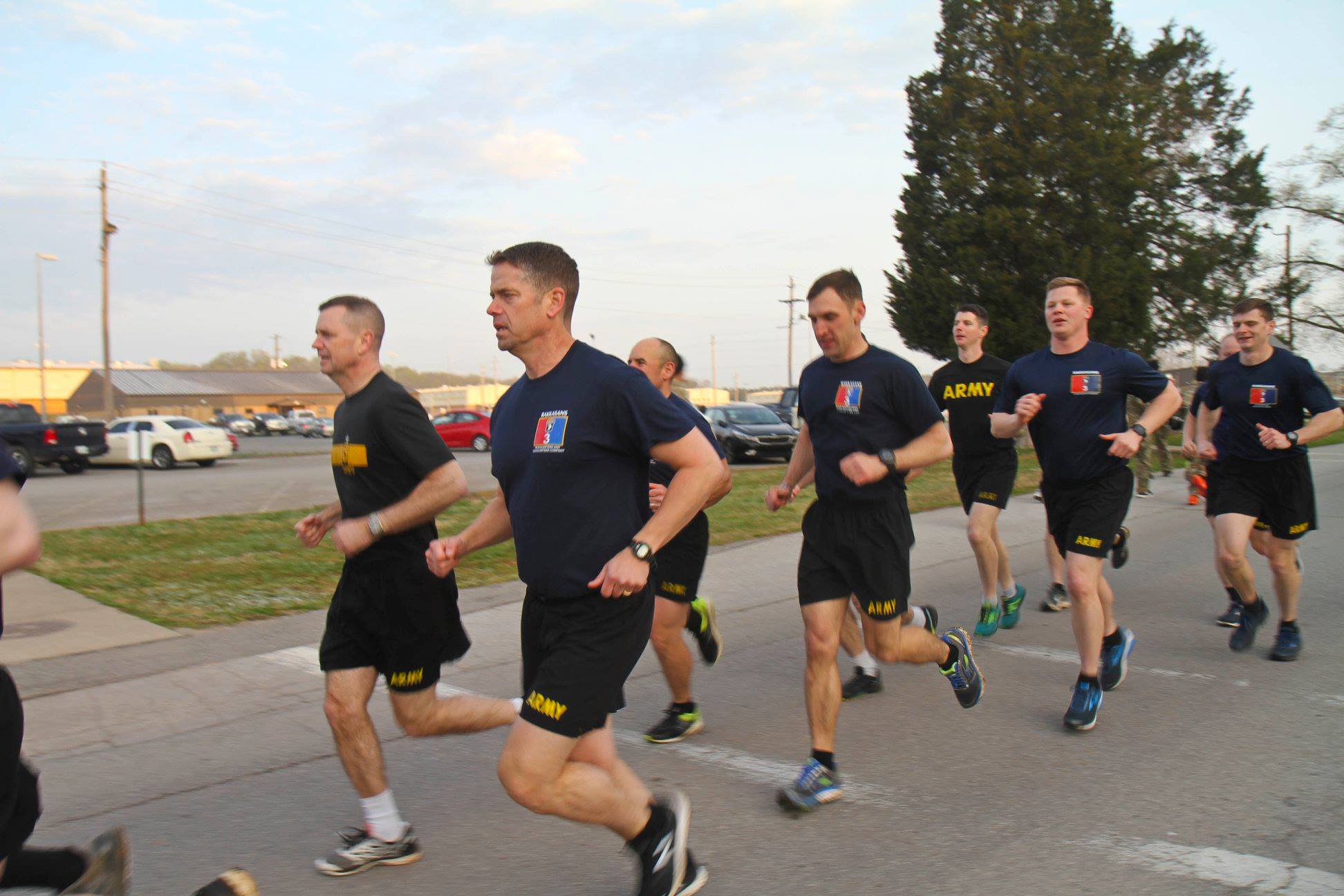 Col. John Cogbill conducts physical training with Brig. Gen. K.