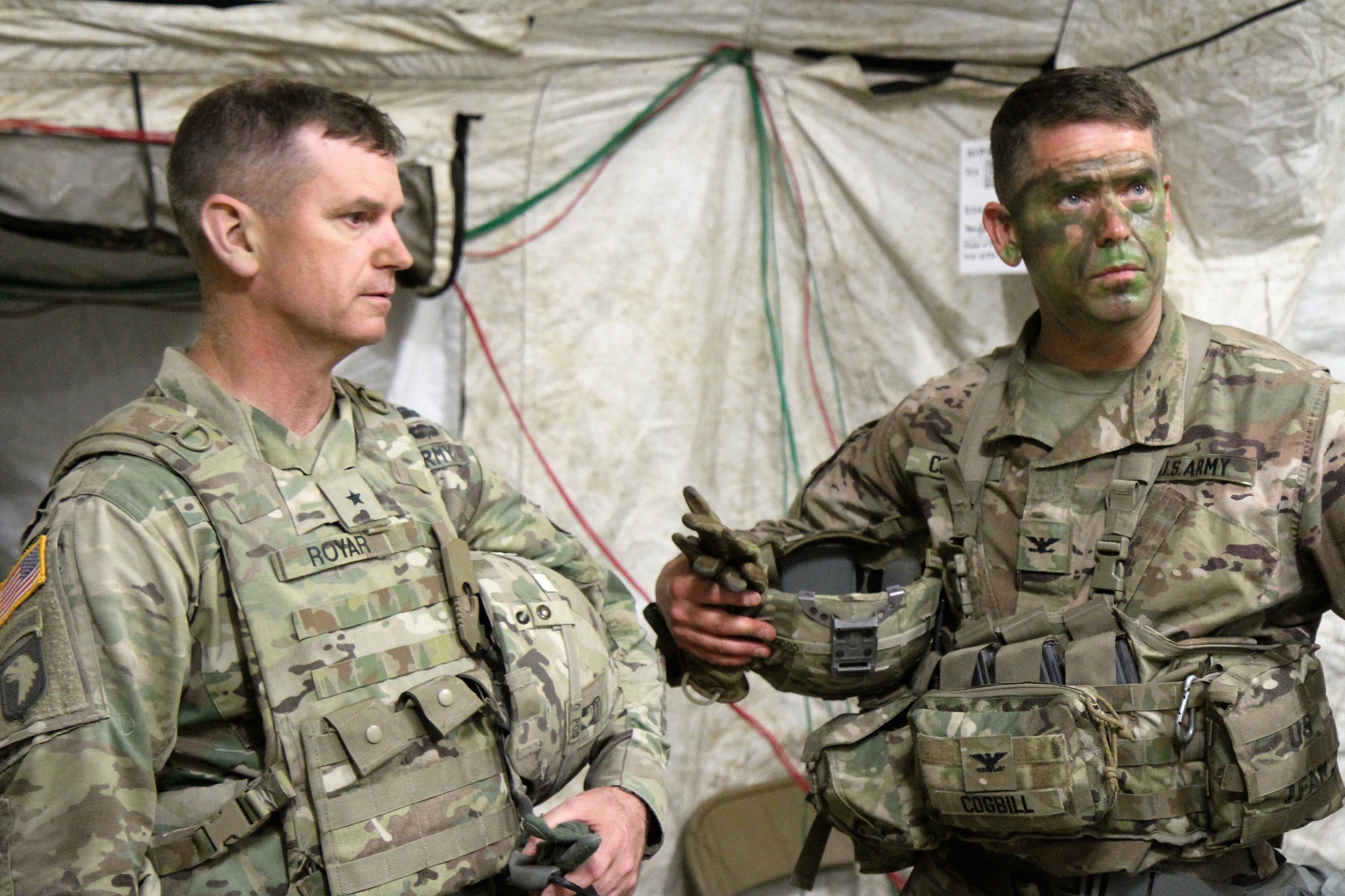 Col. John Cogbill (right) and Brig. Gen. K. Todd Royar, the 101st Airborne Division Deputy Commanding General, Support, discuss 3BCT training inside the 3BCT Tactical Operations Center (TOC). The TOC is the location where the 3BCT Headquarters and Staff conduct battle tracking and mission planning when deployed during training events and tactical operations. (U.S. Army Photo by Staff Sgt. Cody Harding - taken May 10, 2018).