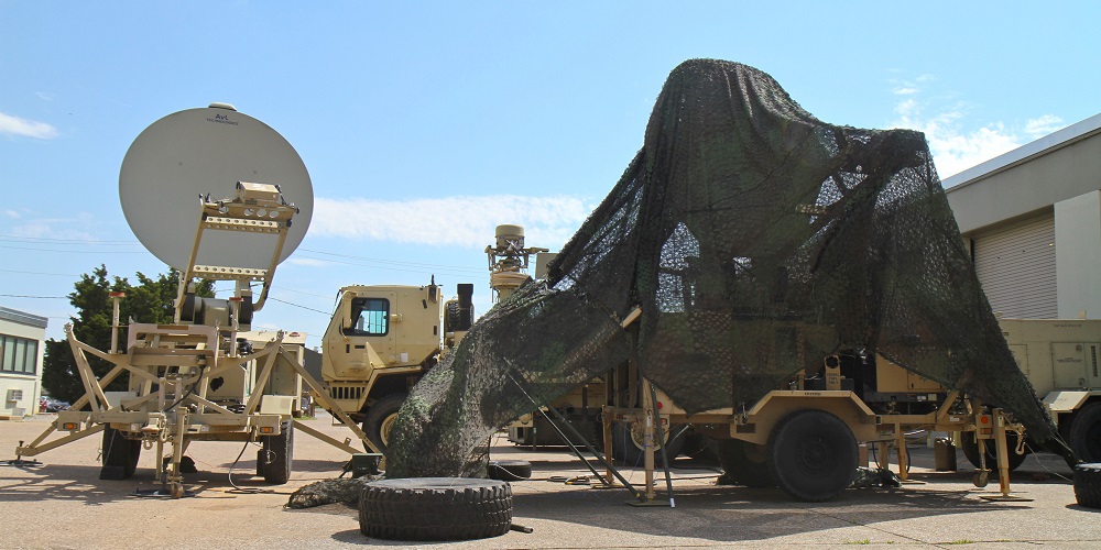 A Satellite Transportable Terminal covered in camouflage netting is being tested for CERDEC, the result of two factors: the 3rd BCT’s emphasis on embracing innovation and a partnership that developed when the 3rd BCT reached out to other organizations in an effort to develop a more agile expeditionary command post. (U.S. Army photo by Staff Sgt. Cody Harding, 3/101)
