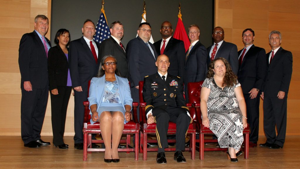 Lareina Adams, second from left, poses with other graduates, instructors and guests during Defense Acquisition University’s Senior Service College Fellowship Program graduation on May 23, 2017. Adams is currently serving as the product lead for the Headquarters Army Environmental System, PM GFEBS, at PEO EIS. She will take on her new role as product manager for Counter Explosive Hazard at PEO IEW&S in the summer of 2019. (Photo courtesy of Lareina Adams)