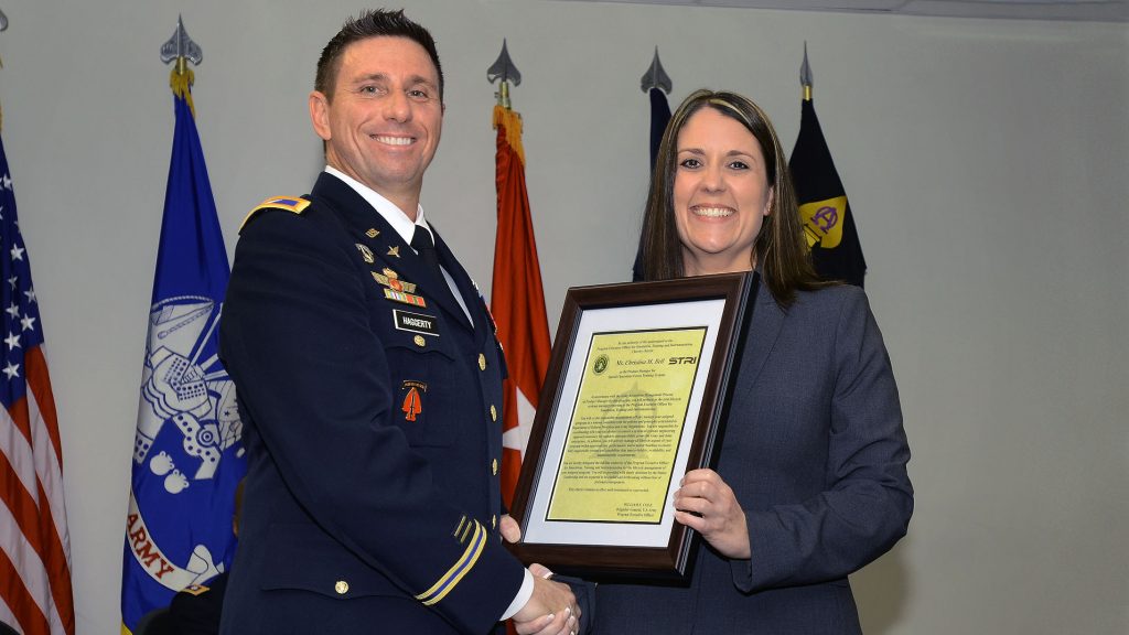 Christina M. Bell, with Col. Rich Haggerty during a change of charter ceremony, officially assumed her role as product manager for Special Operations Forces Training Systems at PEO STRI in June, where she hopes to continue to enable readiness for the warfighter in the special operations forces community. (Photo courtesy of Christina Bell)