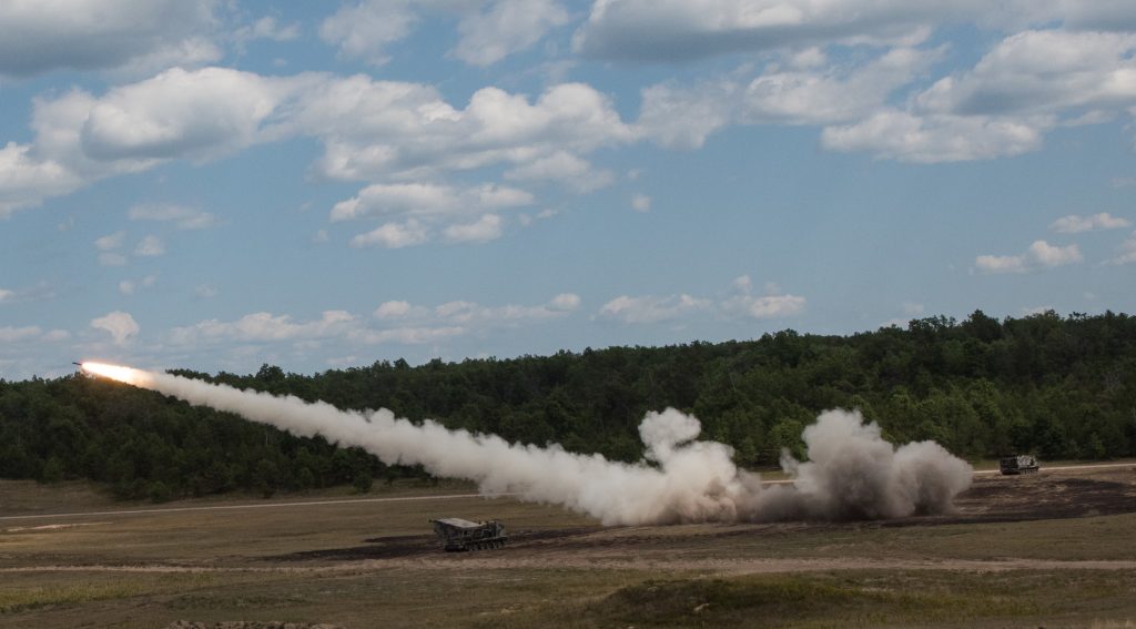 Gun crews of Battery B, 1st Battalion, 147th Field Artillery Regiment, Yankton, S.D., fire their Multiple Launch Rocket System at Camp Grayling, Mich., Aug. 10, 2018. South Dakota Army National Guard Soldiers are participating in Northern Strike, a joint multinational combined arms live fire exercise involving approximately 5,000 service members from 11 states and six coalition countries. (U.S. Army National Guard photo by Spc. Joshua Boisvert)