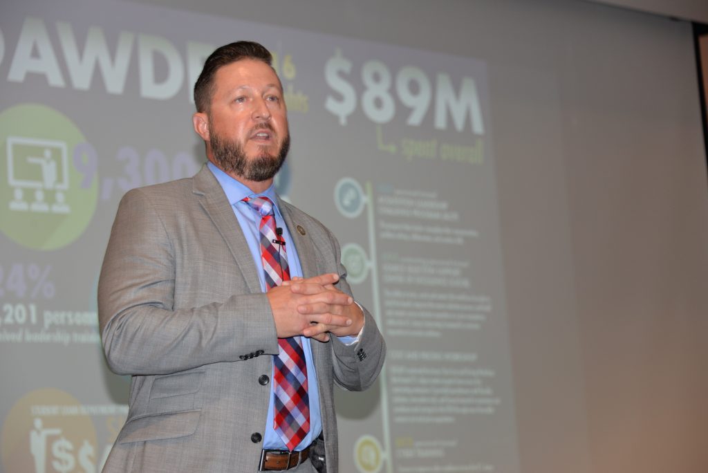 Jason Pitts, chief of the Acquisition Functional Integration Branch at the DACM Office, presents DAWDF financial data to a group of acquisition professionals during the Back to Basics developmental conference in September 2017. DAWDF helps facilitate temporary rotations in other organizations, as well as education and training assignments, to broaden workforce experience. (U.S. Army photo)