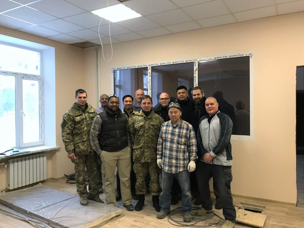 AIT, GDIT and UAF personnel gather for a photo during construction of new Ukrainian Special Operations Forces IT training center, December 2017. Photo credit: Mr. Jeremy Way, AIT support contractor