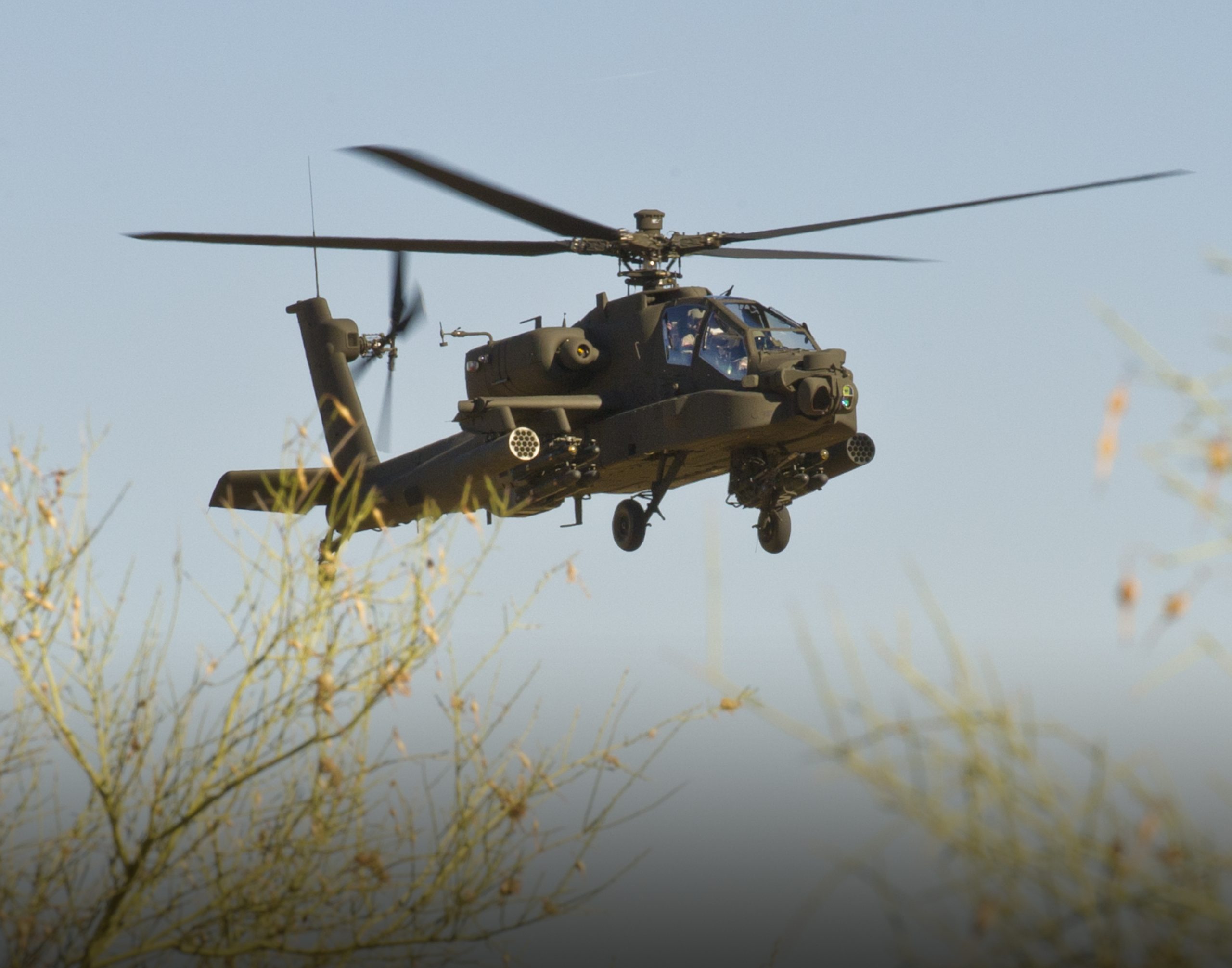 apache helicopter firing rockets