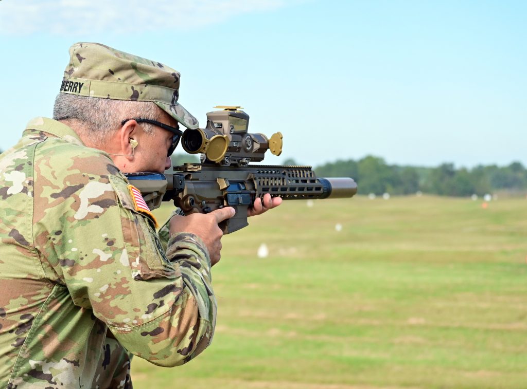 PRIMED FOR REPLACEMENT: Col. Christopher J. Midberry, Fort Campbell Garrison commander, fires an NGSW machine gun in September 2023 during a weapon familiarization demonstration at Fort Campbell, Kentucky. The XM7 rifle and the XM250 automatic rifle are primed to replace their predecessors, the 5.56 mm M4 and M249 light machine gun, and introduce advancements in military firepower. (U.S. Army photo by Kayla Cosby, Fort Campbell Public Affairs Office)