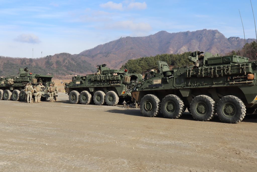 PRE-CHECK: Soldiers from 1-41 conduct pre-combat checks before loading up on the Strykers and crossing the line of departure during platoon certification in Korea. The current method of predicting maintenance doesn’t consider external factors such as training conditions, personnel strength or parts availability. (Photo by 1st Lt. Samuel Hughes, 1-41 Infantry Battalion Public Affairs)