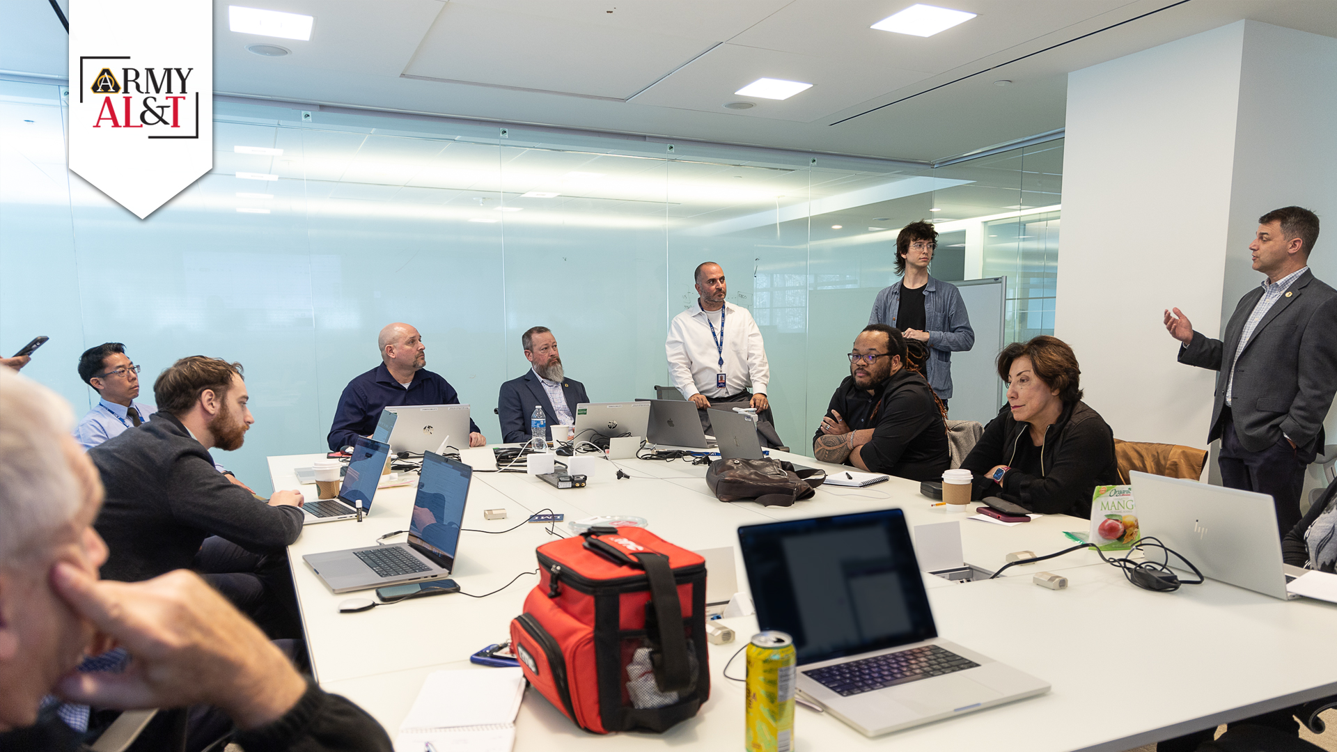 DRAFT OBJECTIVES Product Team One hosts a team breakout session at the program increment planning event where the team’s cross-domain experts and government product owner draft and prioritize their objectives for the next 10 weeks of development. (Photos by Dave MacLuskie, Product Manager ATIS)