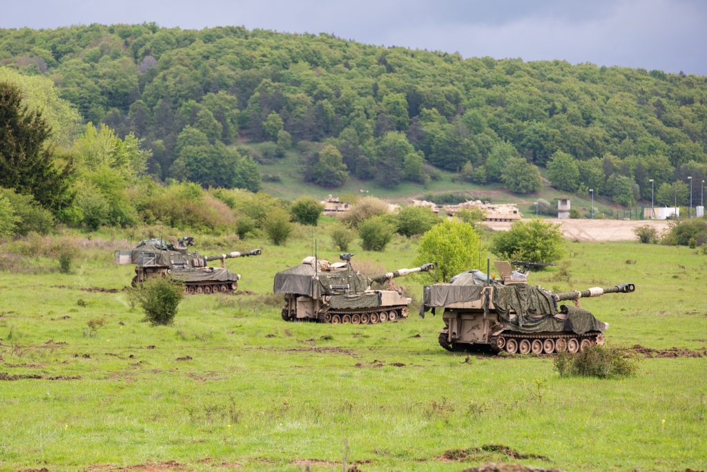 MISSION ACCOMPLISHEDPaladin howitzers prepare to receive a fire mission during exercise Combined Resolve 18, held in May 2023 in Hohenfels, Germany. The exercise included more than 4,000 service members, allies and partners from 15 countries, and was designed to assess units’ abilities to conduct combat operations in a multidomain battlespace. (Photo by Spc. Casandra B. Ancheta, 117th Mobile Public Affairs Detachment (Hawaii)) 