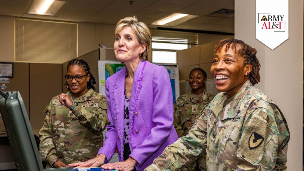 Picture of two Soldiers and one Army civilian