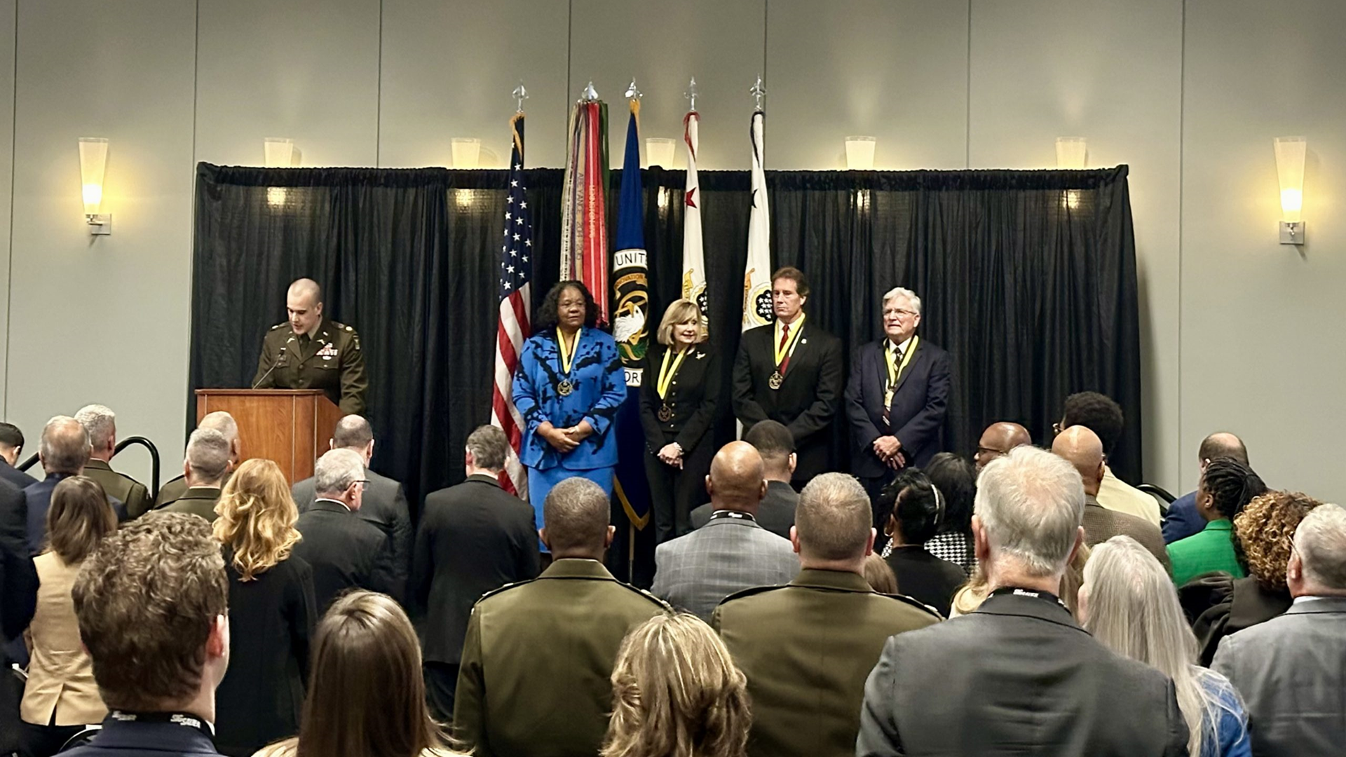 HALL OF FAME INDUCTEES: The Class of 2024 Army Acquisition Hall of Fame inductees are honored at the Army Acquisition Hall of Fame ceremony after receiving their medals. From left, Maureen Cross, Cathy Dickens, Gary Winkler and Joseph Yakovac. (Photo by Rachel Longarzo, USAASC)