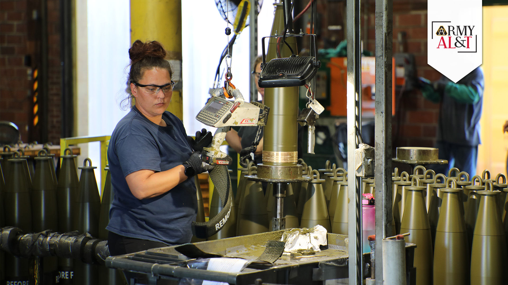 PACK OUT An IAAAP employee prepares 155 mm rounds for load, assemble and pack, May 15, 2024. (Photo by Dori Whipple, Joint Munitions Command, Public and Congressional Affairs)