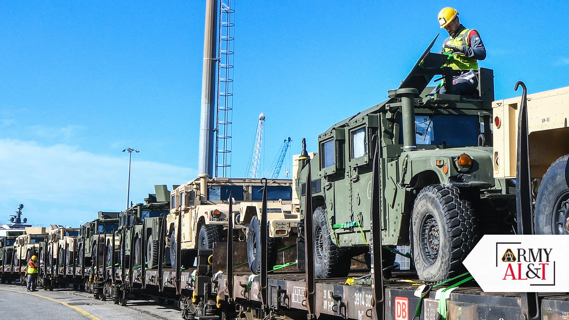 MOVE ON THROUGH Humvees and other equipment are loaded onto a train at the port of Livorno, Italy, to begin their trip to Eastern and Northern Europe. The EDA program transfers previously used, excess equipment from U.S. units to America’s foreign partners and allies. (Photo by Elena Baladelli, Training Support Activity Europe)