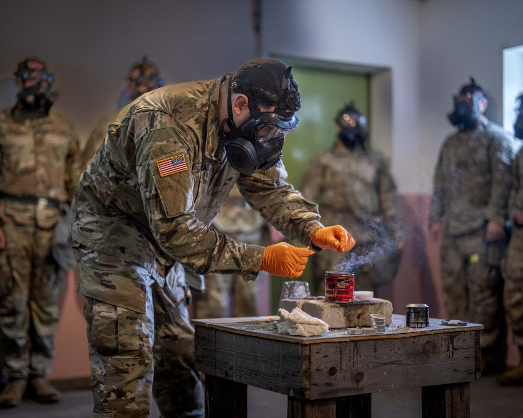 PUTTING IT TO THE TESTU.S. Army Sgt. 1st Class Carlos Moranbonilla, 10th Army Air and Missile Defense Command, creates tear gas during a comprehensive CBRN training held by Headquarters and Headquarters Battery in Landstuhl, Germany on May 31, 2024. (Photo by Sgt. Yesenia Cadavid, 10th Army Air and Missile Defense Command) 