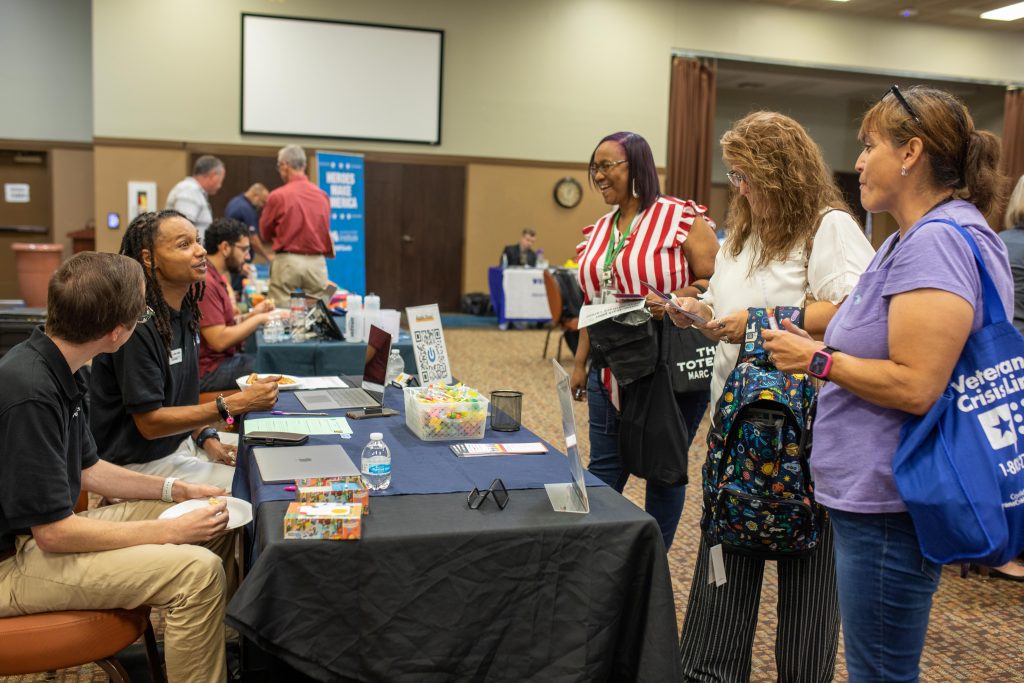 LET’S TALK: Representatives from Peak Performance, a nonprofit that helps job seekers with disabilities find careers, speak with attendees during the annual Technology Fair on September 14, 2023, at the Fort Cavazos Community Center. The Army supports employees with disabilities by providing equitable and inclusive employment. (Photo by Samantha Harms, Fort Cavazos Public Affairs)