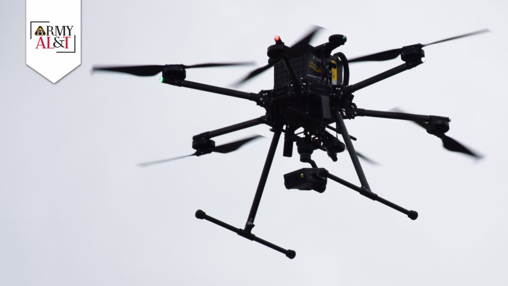 EYE IN THE SKY: A drone gets a closer look at intruders while flying above the Blue Grass Army Depot—the only DOD installation testing AI software to enhance physical security. (Photo by Greg Kocher, BGAD)