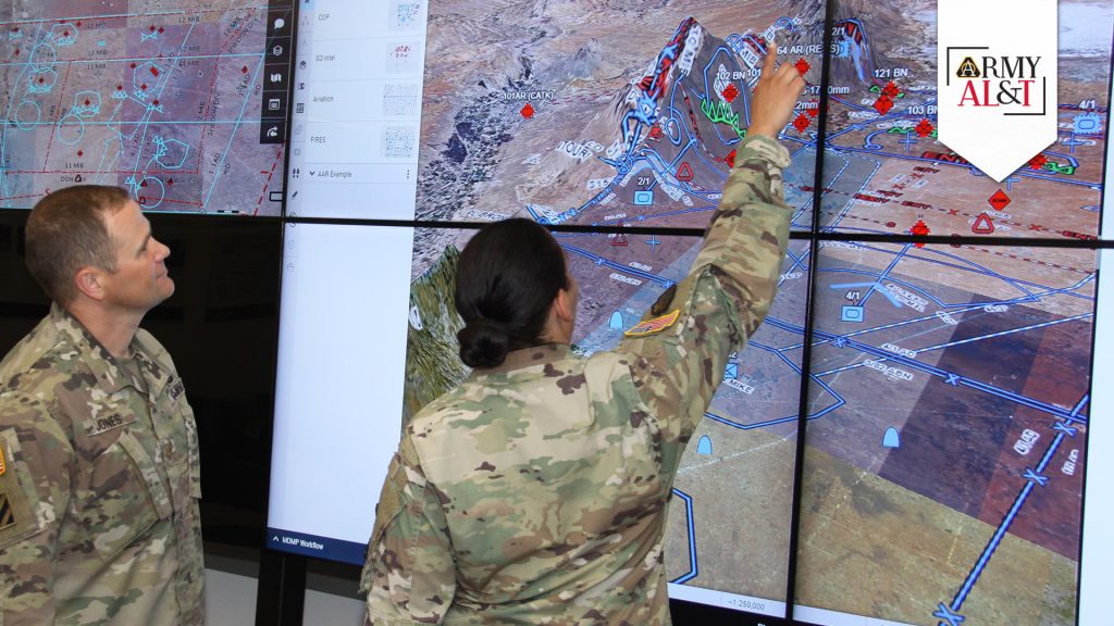 MAP BREAK: Soldiers at the Tactical Systems Integration Facility at Aberdeen Proving Ground, Maryland, use digital planning platforms to project live geospatial, weather and force structure data onto a map. (Photo by Dan Lafontaine, DEVCOM C5ISR Center)