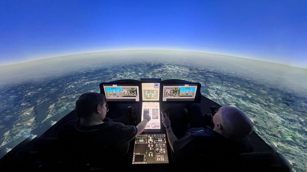 The FLRAA team shows Col. Matthew Scher, the 25th Combat Aviation Brigade commanding officer, what his Soldiers can expect from the FLRAA in the 3rd Battalion, 25th Aviation Regiment hangar on September 9, 2024. A tiltrotor aircraft, FLRAA will have the hybrid capabilities of both planes and helicopters. (Photo by Spc. Charles Clark, 25th Infantry Division)