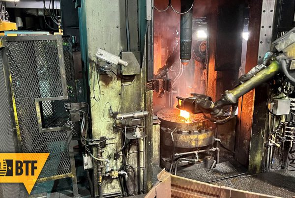A robot arm loads hot metal cases into the Erie 1 Press at Scranton AAP in Pennsylvania. This is one of the steps in the production chain that can be simulated using the digital twin of the Scranton AAP. (Photo courtesy of PL JS)