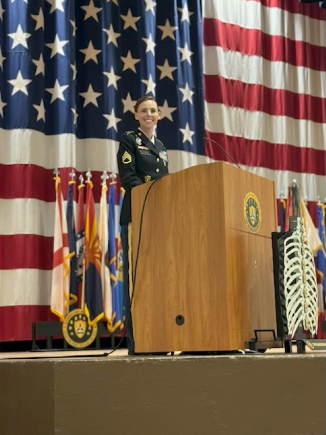 Kennedy at the podium speaking 