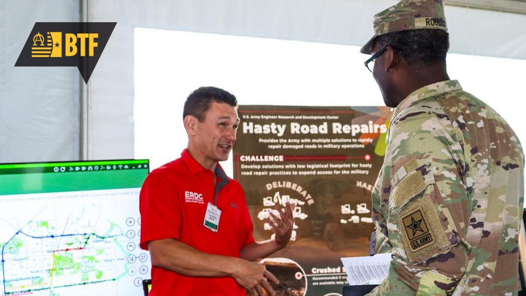 John Rushing, speaks with an S&T Day attendee