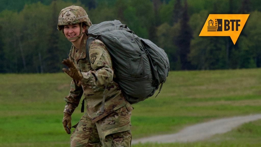 Maj. Mary Lord leaving the drop zone after a successful UH-60 jump in June 2016 at Joint Base Elmendorf-Richardson.