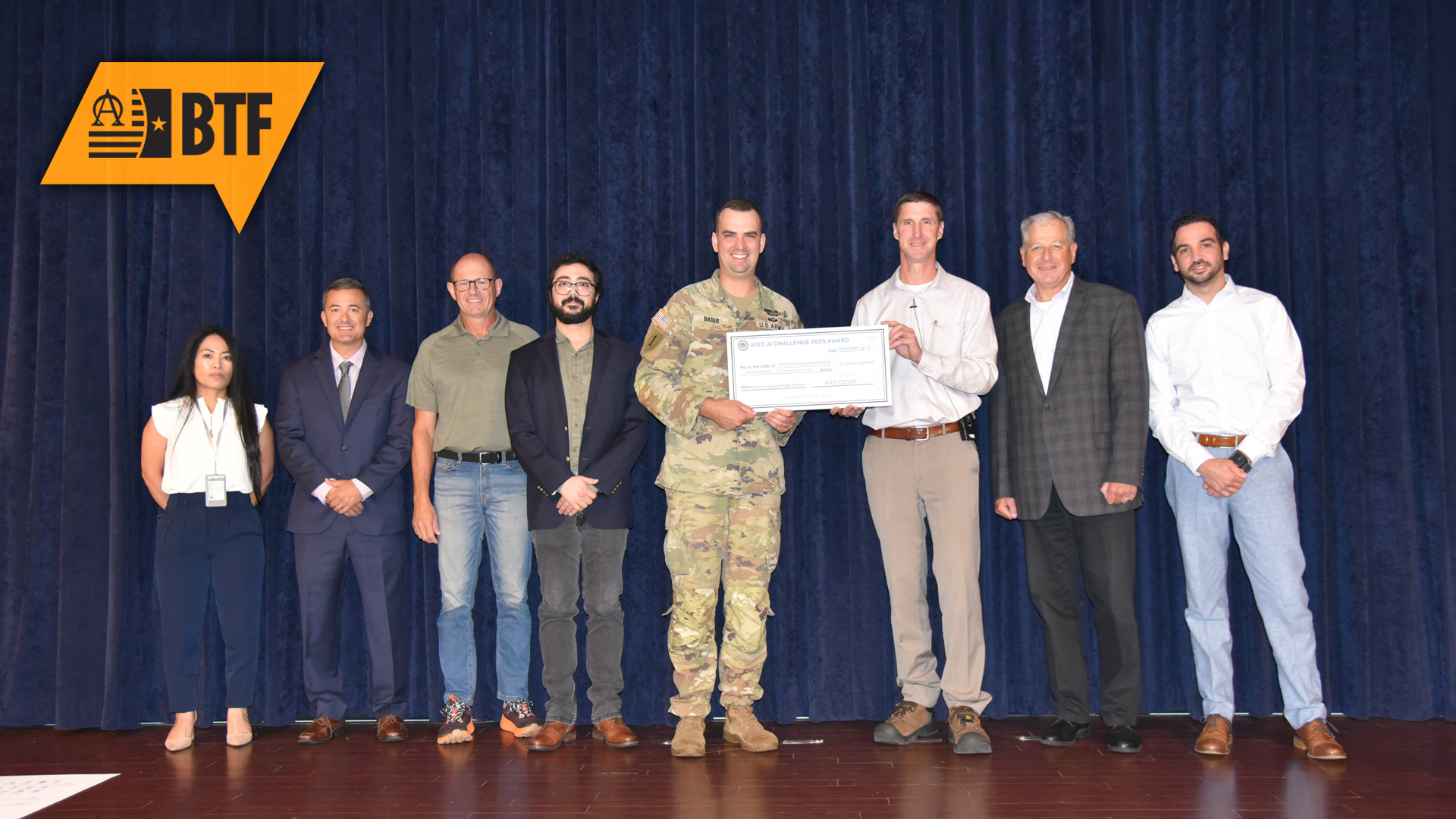 The U.S. Army Evaluation Center’s Army Evaluation Plan Ghostwriter team and the U.S. Army Operational Test Command's Document Generator Workflow team shared the top prize for the third annual ATEC AI Challenge during the fourth annual ATEC Data Summit on Sept. 18, 2025. The Ghostwriter team from left is Anna Campbell, Matthew Pandullo, Mark Downes, Hasan Shahid, Maj. Daniel S. Bader, Brian Kelly, Jim Amato and Gabriele Chiulli.