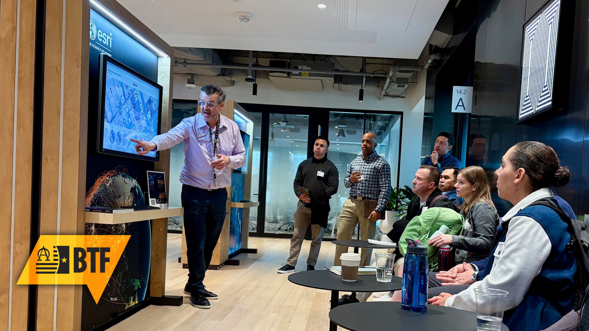 TWI fellows observe a demonstration of ESRI during a tour of Microsoft’s Innovation Hub during the January 2026 Midpoint Review.